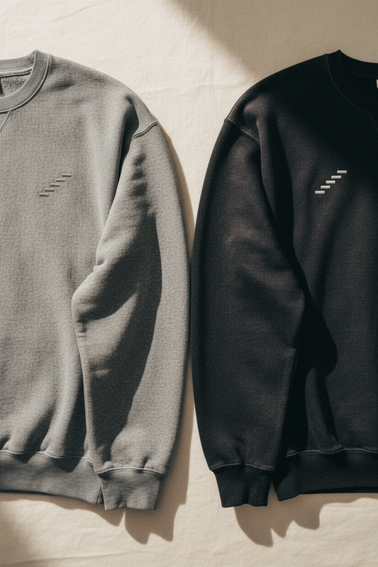 echelonn. thorax. sweatshirts in grey and washed black side by side — tonal echelonn. wordmark on left chest, 400gsm ring-spun cotton
